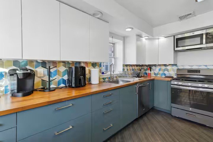 Kitchen counters with sink, dishwasher, and range